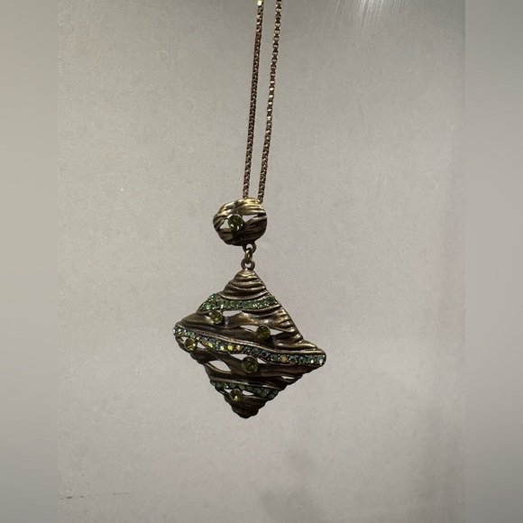 Wavy Textured Gold-Tone Pendant with
Sparkling Green Gems - Picture 3 of 9